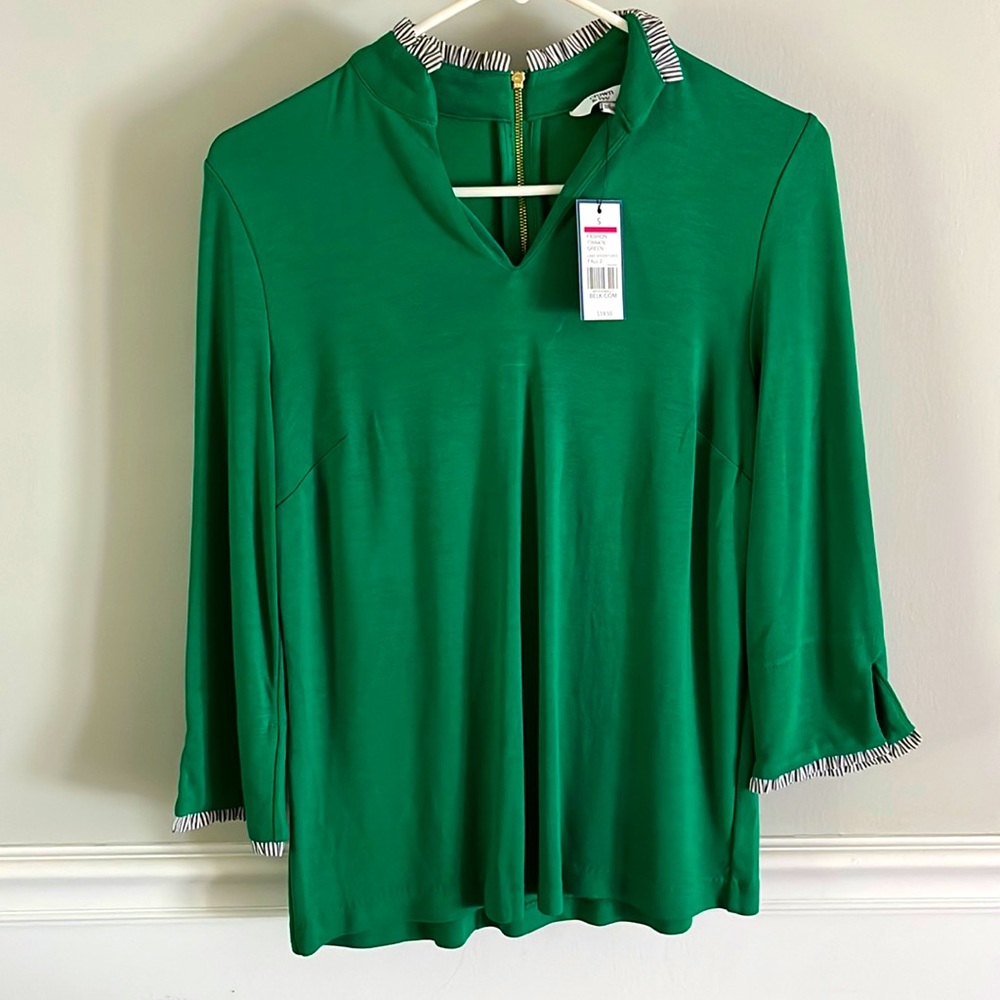 Green top Crown and Ivy. Gold zipper, upper back.